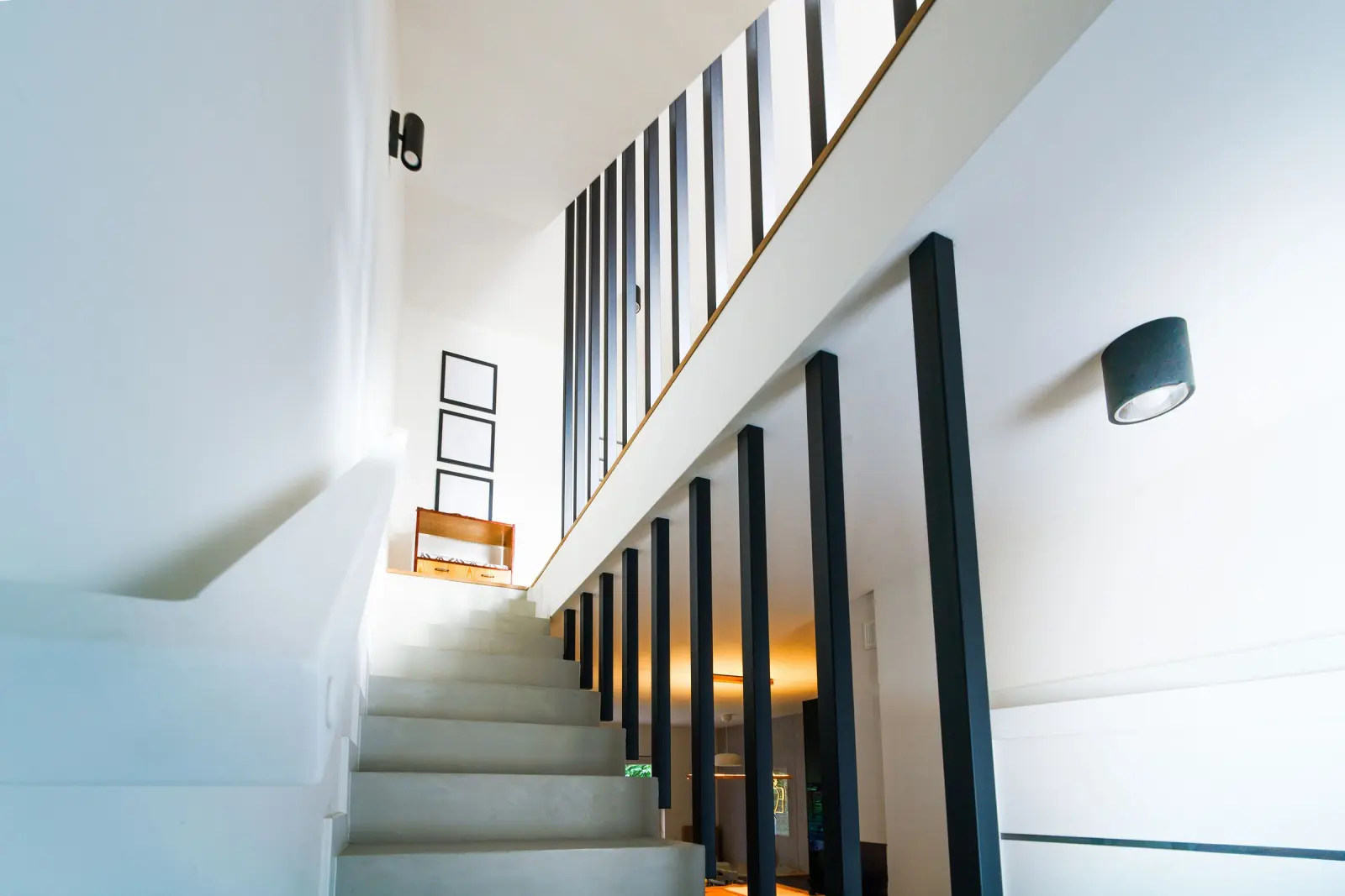 A white interior staircase in natural light.