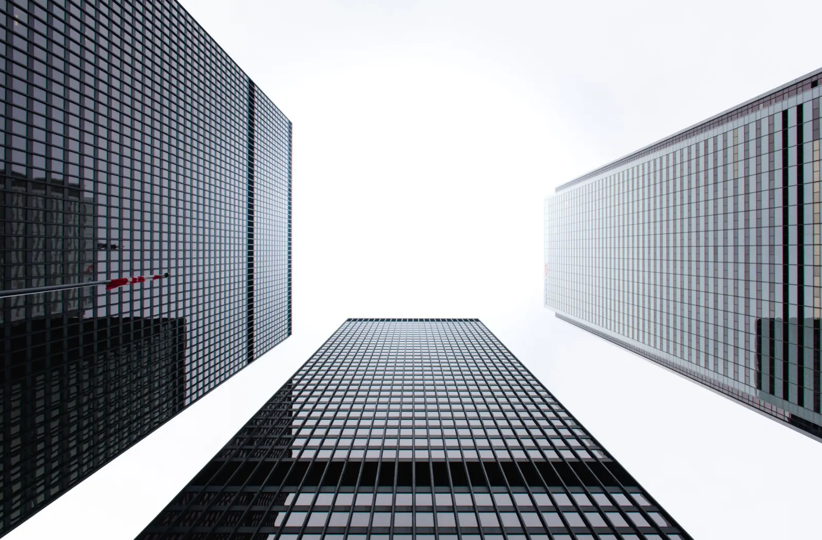 Glass office towers seen from street level.